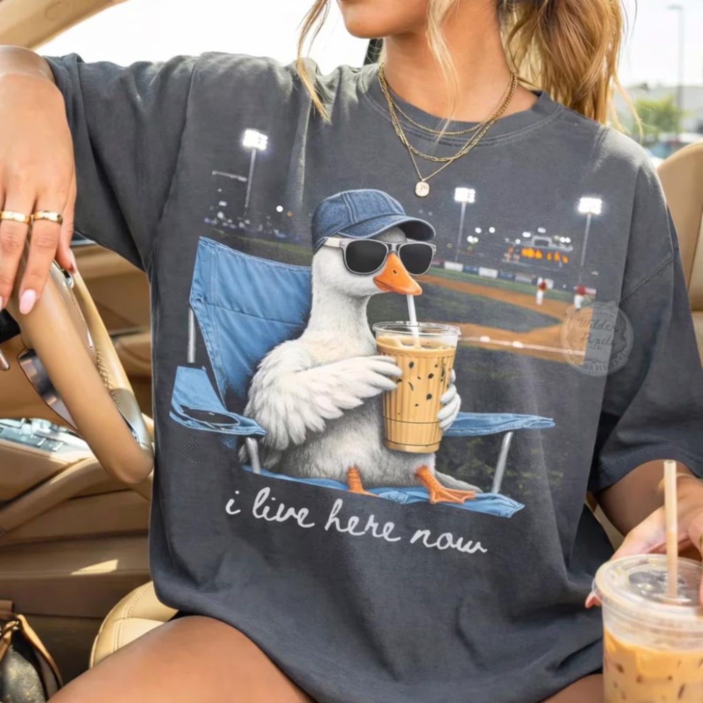 I Live Here Now Goose with Iced Coffee Baseball Field Graphic T-Shirt Pepper Comfort Colors Tee