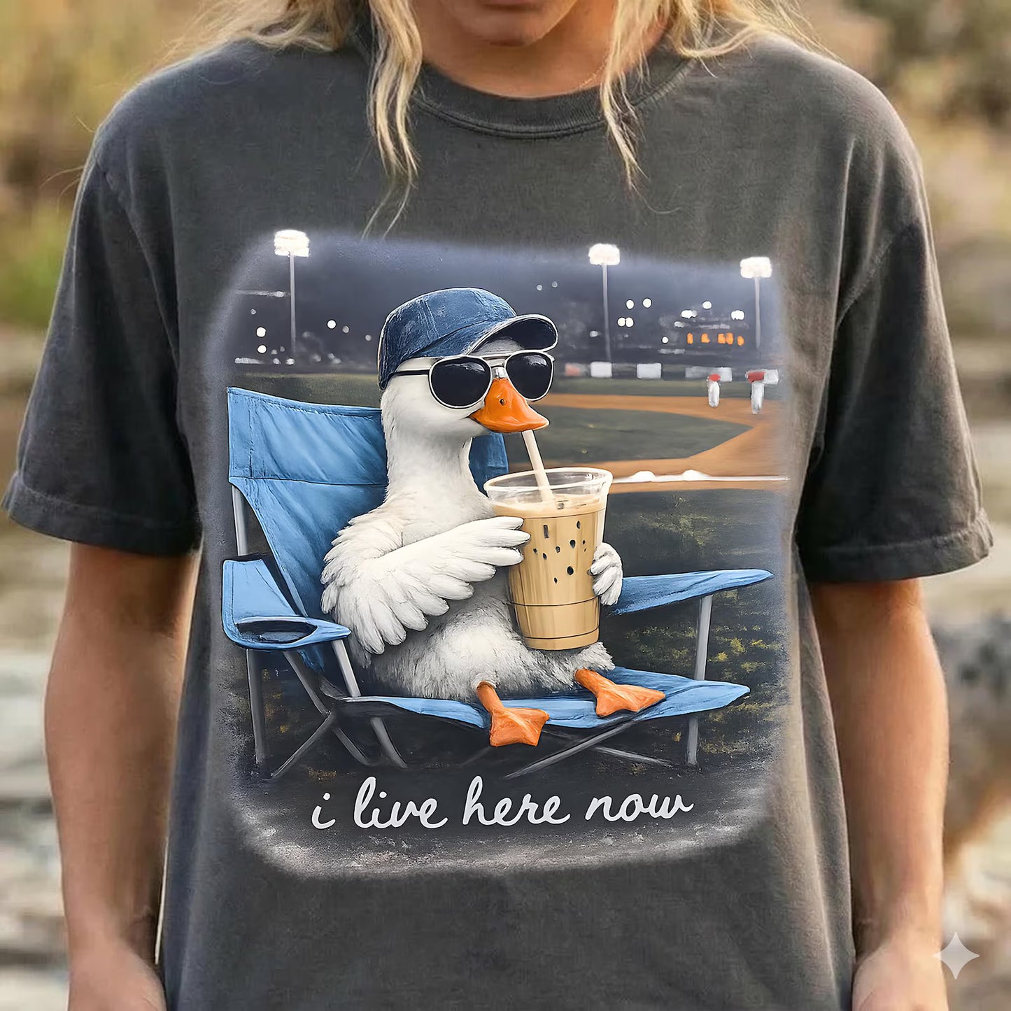 I Live Here Now Goose with Iced Coffee Baseball Field Graphic T-Shirt Pepper Comfort Colors Tee